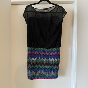 Aqua black dress with multi colored banded bottom with mesh on the top.